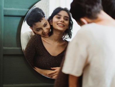 A woman intimately cuddling with a trans escort