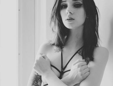 Confident professional escort preparing for a client meeting
