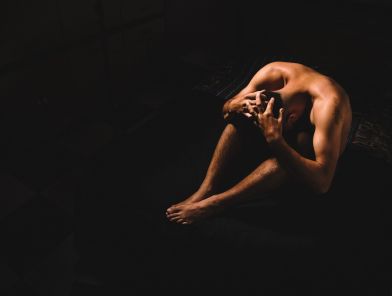 Stressed man experiencing erectile dysfunction symptoms