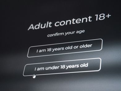 Person using age verification app on their phone in everyday setting