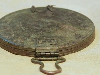 Ancient Greek bronze mirror discovered in a 2300-year-old Jerusalem tomb proving the world's first prostitute was a Greek escort