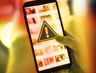 Smartphone screen showing porn content being blocked or restricted.